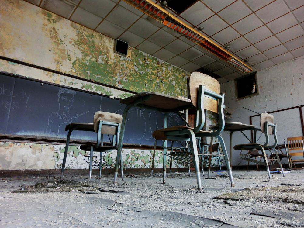 Abandoned school classroom with desks in Gary, Indiana - landscape photo