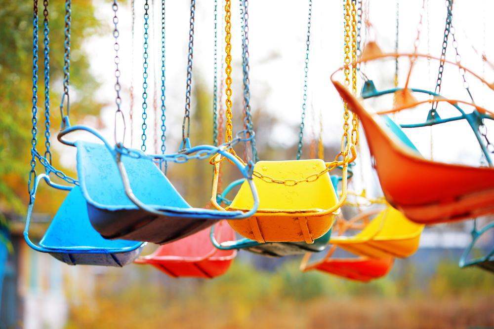 Old children's carousel in an abandoned park