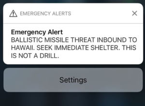 A screenshot taken by Hawaiian citizen Alison Teal shows the screen of her mobile phone with an alert text message sent to all Hawaiian citizens on January 13, 2018. / AFP PHOTO / Alison TEAL 