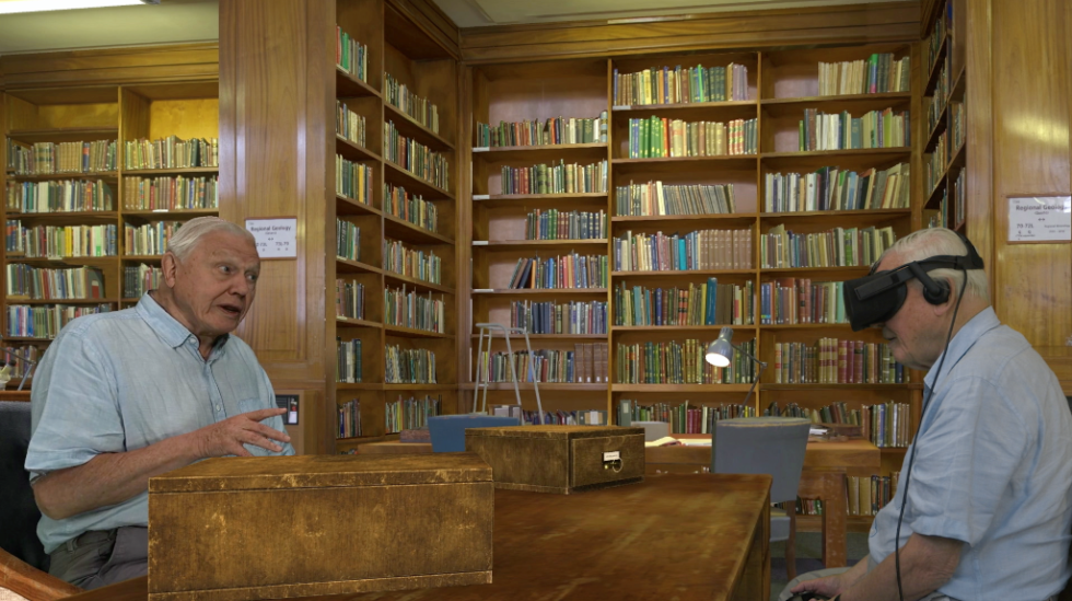 VR Attenborough (left) guides real-life Attenborough (right) through <em>Hold the World</em>. The amount of polygonal detail devoted to his face, arms, and shirt is remarkable in action.