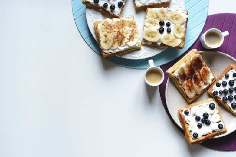 Photography by Jakub Kapusnak for [Foodies Feed](https://www.foodiesfeed.com/free-food-photo/banana-and-bluberries-waffles-with-coffee-espresso-4/)