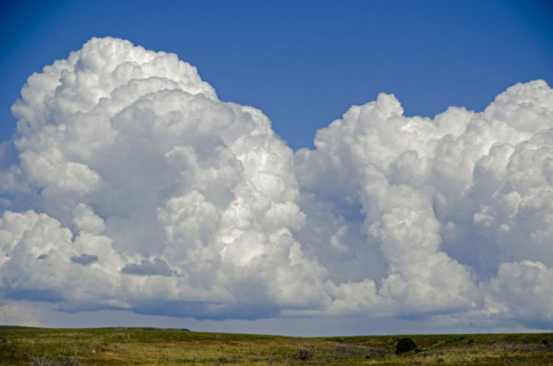 Big white clouds against an azure sky.