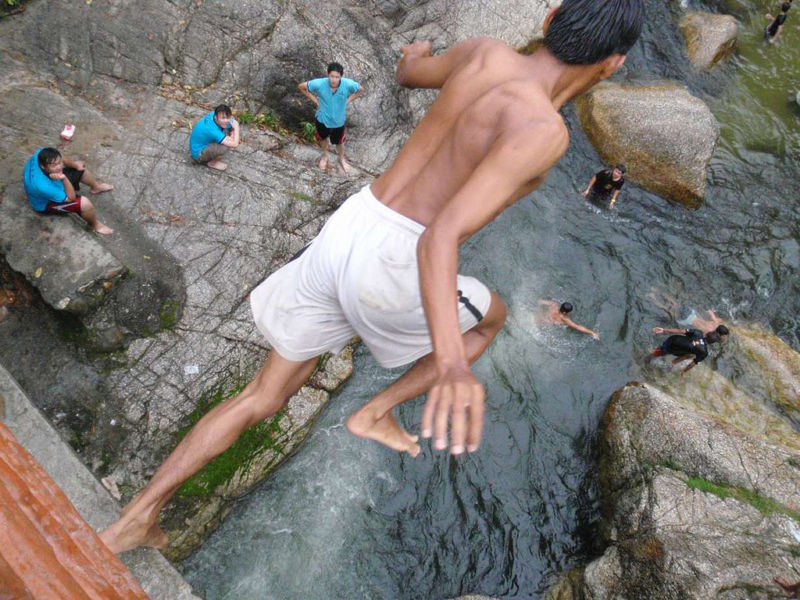 Image of someone jumping off a bridge.