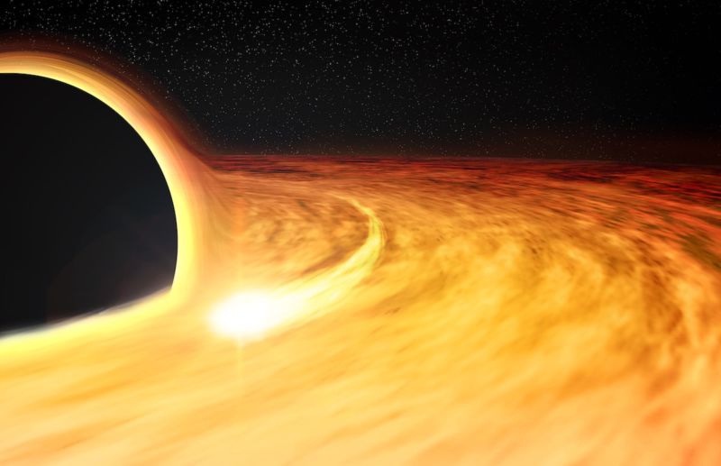 Image of a bright disk surrounding a dark sphere.