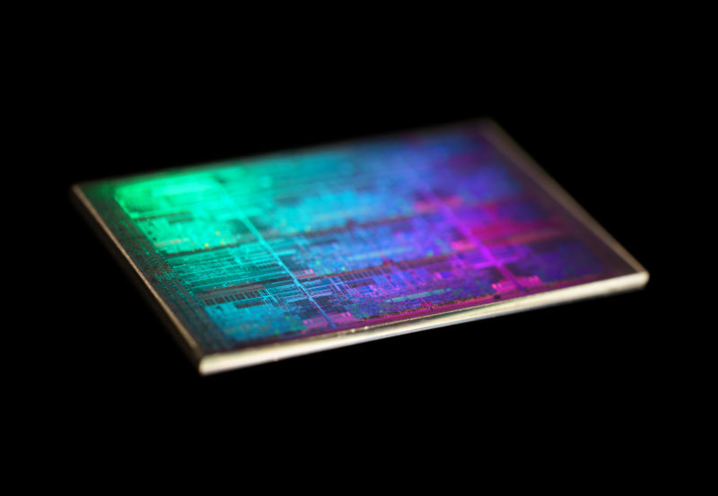 Extreme close-up photograph of computer chip against a black background.