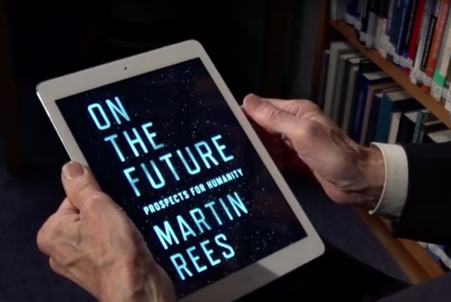 Renowned cosmologist Martin Rees holds the electronic version of his latest book, <em>On the Future</em>.