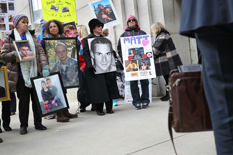 BOSTON, MA - JANUARY 25: Families who have lost loved ones to the opioid crisis protest in front of Suffolk Superior Court in Boston as lawyers for Purdue Pharma enter the courthouse for a status update in the Attorney General's suit against Purdue Pharma.