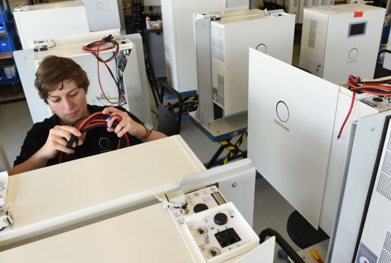 A worker assembling a Sonnen battery.