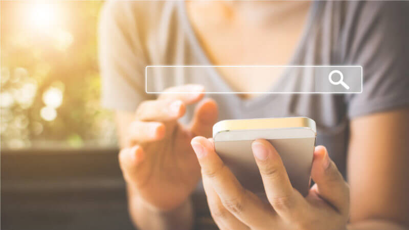 Woman searching on mobile phone