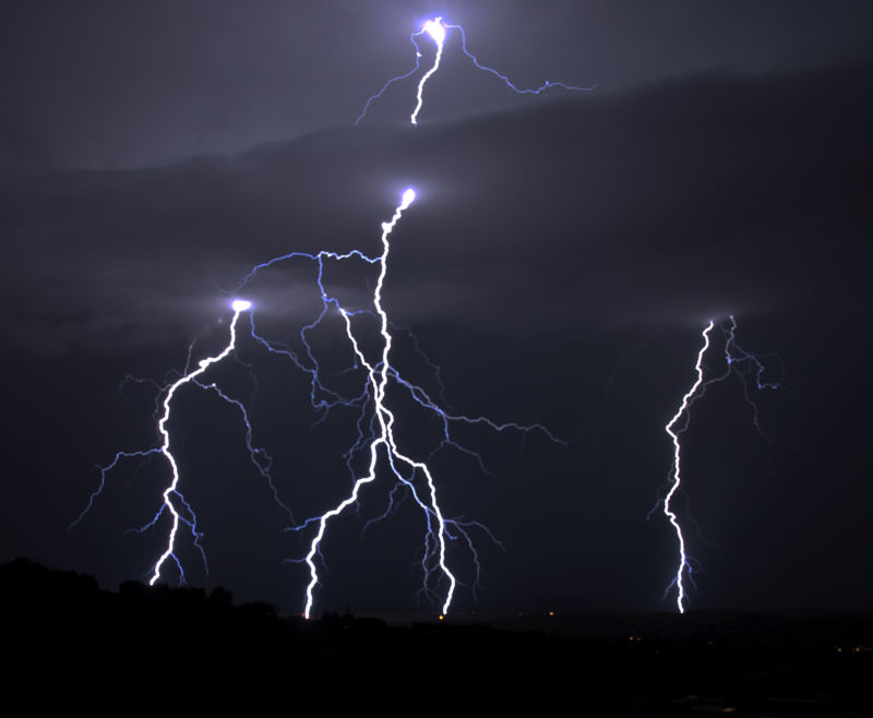 Lightning blazes across the night sky.