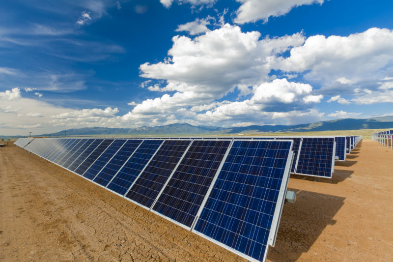 Blue sky over solar panels.