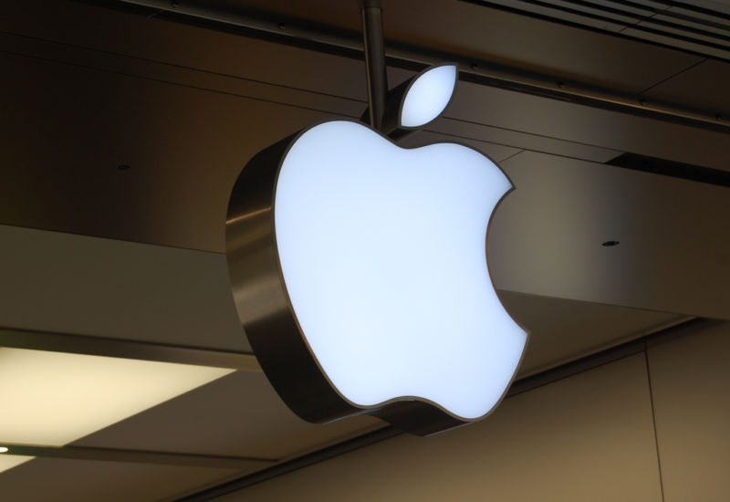 The Apple logo takes corporeal form outside an Apple store.