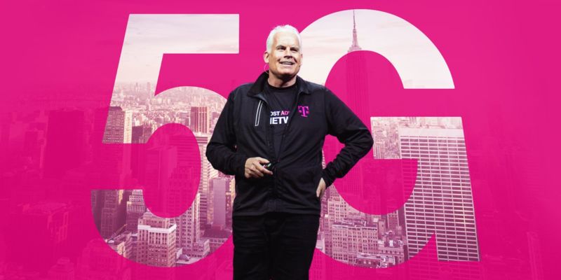 T-Mobile CTO Neville Ray stands in front of a backdrop that says,
