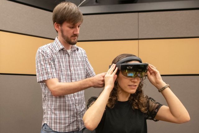 Co-author Mark Miller works with lab manager Talia Weiss to run through the experiment during a testing phase.