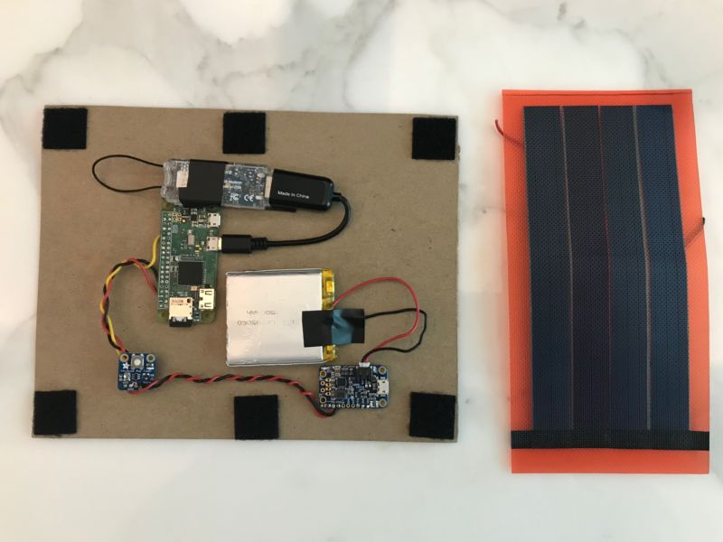 Computer components attached to a piece of cardboard.