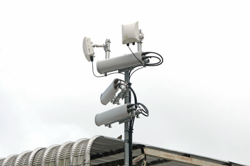 You really can find anything in a stock image library: "Antennas of mobile cellular systems with Wi-Fi hot spot repeater and blue sky."