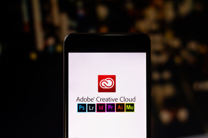 Photo illustration of Adobe Creative Cloud apps running on a smartphone.