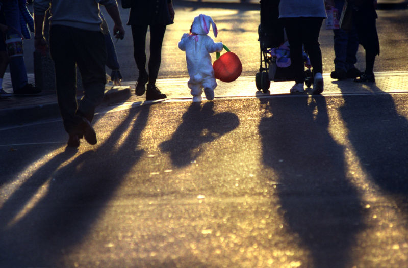 Trick-or-treaters set out at sundown.