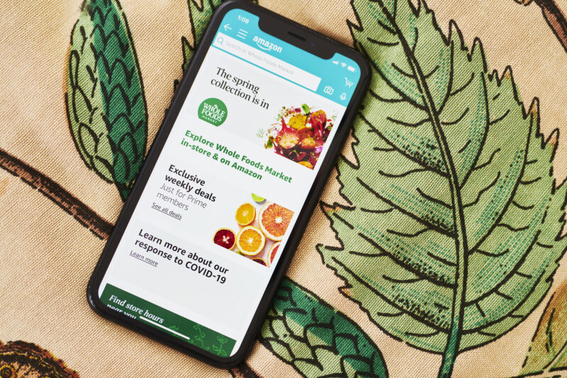 A smartphone displays the Whole Foods app.