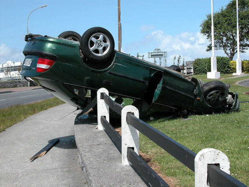 Photograph of a crashed car.