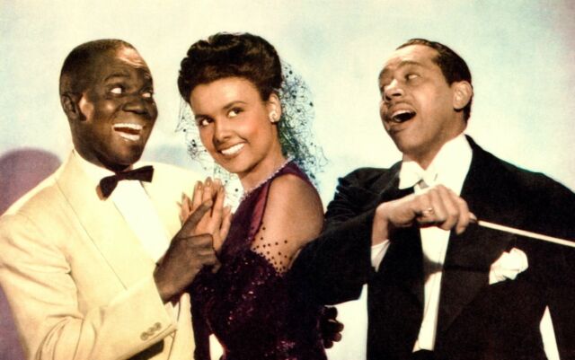 Bill Robinson as Bill Williamson, Lena Horne as Selina Rogers, and Cab Calloway as himself in the 1943 film <em>Stormy Weather.</em>