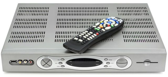 A cable TV box and remote control.