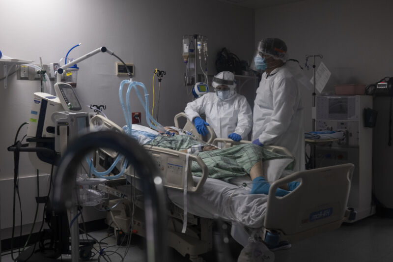Members of the medical staff treat a patient in the COVID-19 intensive care unit at the United Memorial Medical Center on July 28, 2020 in Houston, Texas. COVID-19 cases and hospitalizations have spiked since Texas reopened, pushing intensive-care units to full capacity and sparking concerns about a surge in fatalities as the virus spreads.