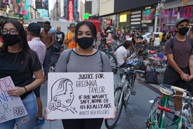 The pandemic, of course, isn't the only major happening of 2020—museums are trying to capture materials from everything from the Black Lives Matter protests to electisn materials to back to school imagery. Here, a protester holds a placard at Timss Square during the Black lives Matter protest in early August.