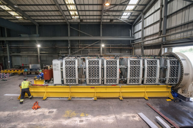 The entire 12-rack, 864-server data center is slid from the hull of the <em>Northern Isles</em> as a unit, after preliminary <em>in situ</em> analysis.