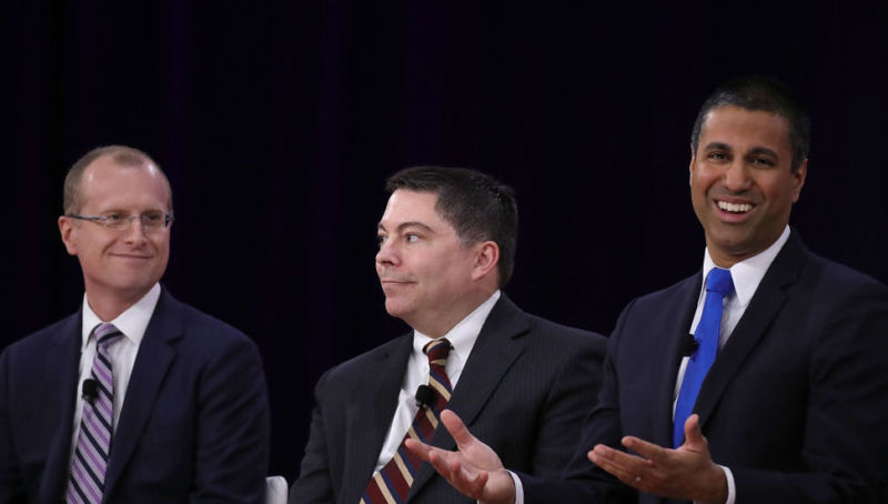 FCC members Brendan Carr, Michael O'Rielly, and Chairman Ajit Pai participating in a panel discussion.