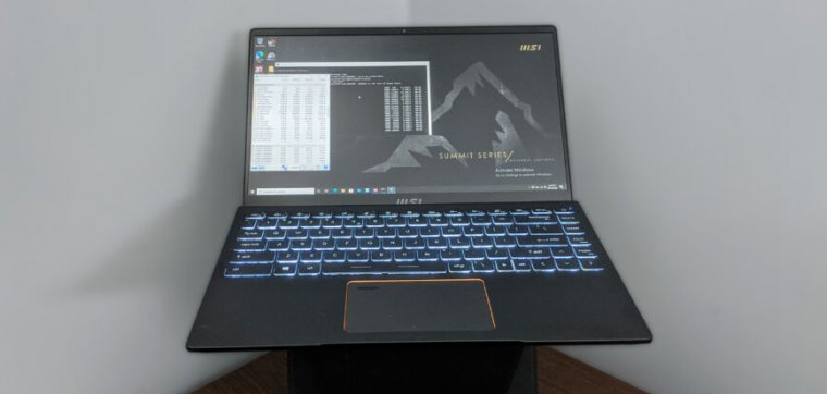 A laptop computer sits triumphant on a desk.