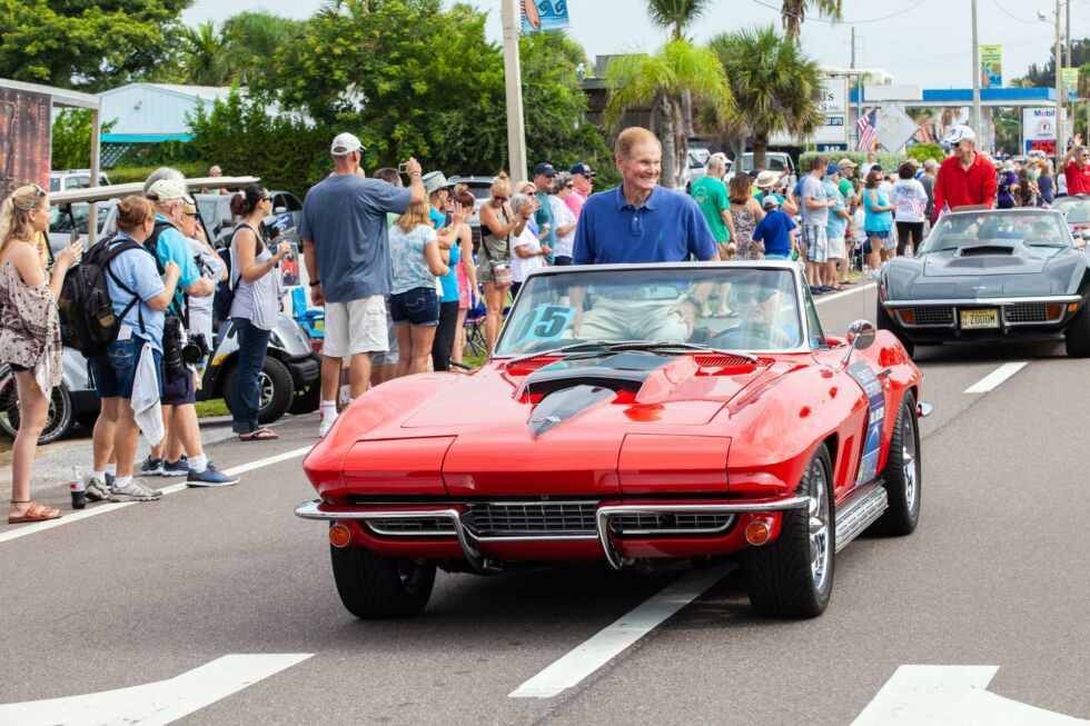 One-time shuttle astronaut and former US Senator Bill Nelson rides in a classic Corvette&nbsp;during the "Man on the Moon" astronaut parade in Cocoa Beach, Florida on July 13, 2019. 