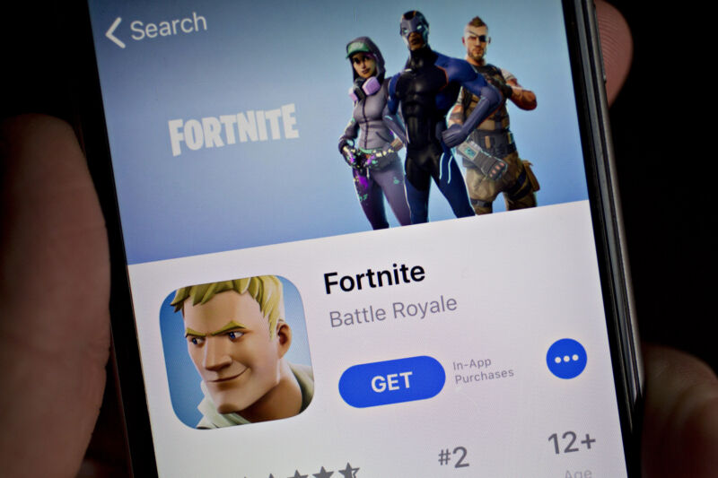 <em>Fortnite</em> seen in the App Store on an iPhone on May 10, 2018. “><figcaption class=