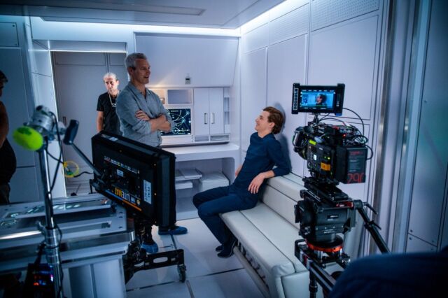 Director Neil Burger on set with Tye Sheridan, who plays Christopher.