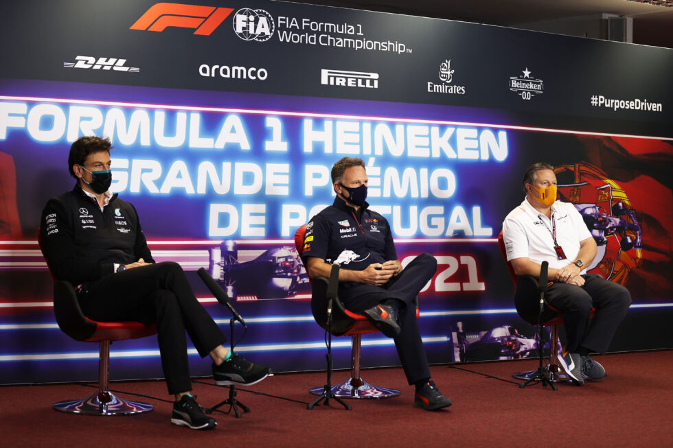 Mercedes GP Executive Director Toto Wolff (L), Red Bull Racing Team Principal Christian Horner (M), and McLaren Chief Executive Officer Zak Brown (R) talk in the Team Principals Press Conference during practice ahead of the F1 Grand Prix of Portugal at Autodromo Internacional Do Algarve on April 30, 2021, in Portimao, Portugal. 