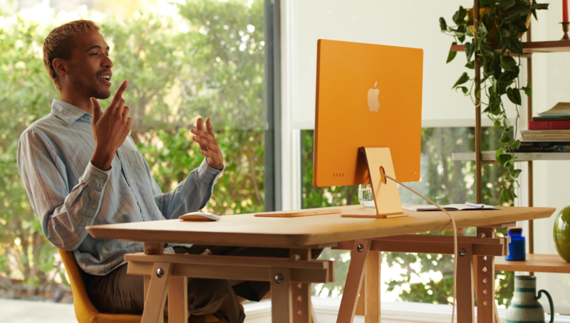 A man works on an iMac