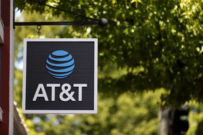 An AT&T sign in front of a retail store