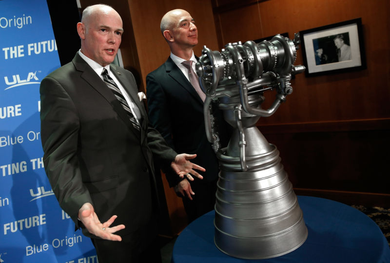 Jeff Bezos (right), the founder of Blue Origin and Amazon.com, and Tory Bruno, CEO of United Launch Alliance, display the BE-4 rocket engine during a press conference in 2014.