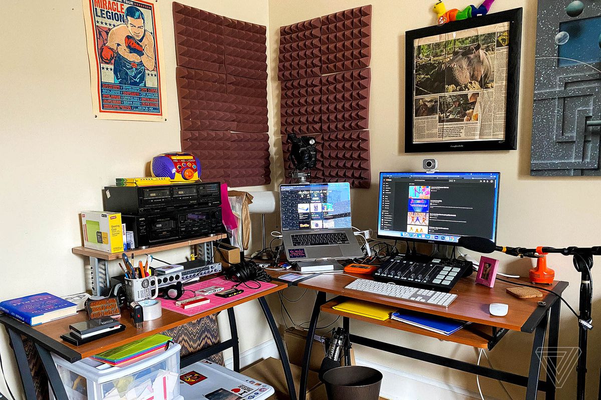 A corner desk in the bedroom for personal audio projects.