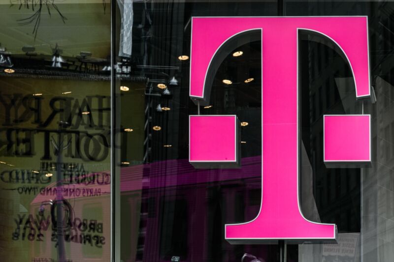 A T-Mobile logo on the window of a store.