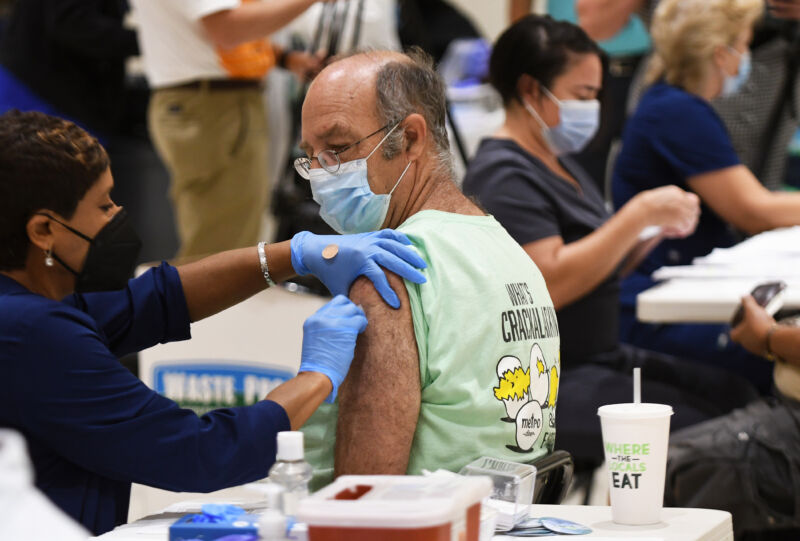 A nurse administers a COVID-19 shot at a vaccination site in Florida on August 18, 2021.