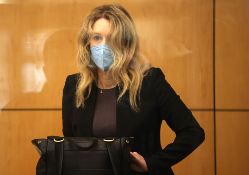 Former Theranos founder and CEO Elizabeth Holmes goes through security after arriving for court at the Robert F. Peckham Federal Building on September 17, 2021, in San Jose, California.