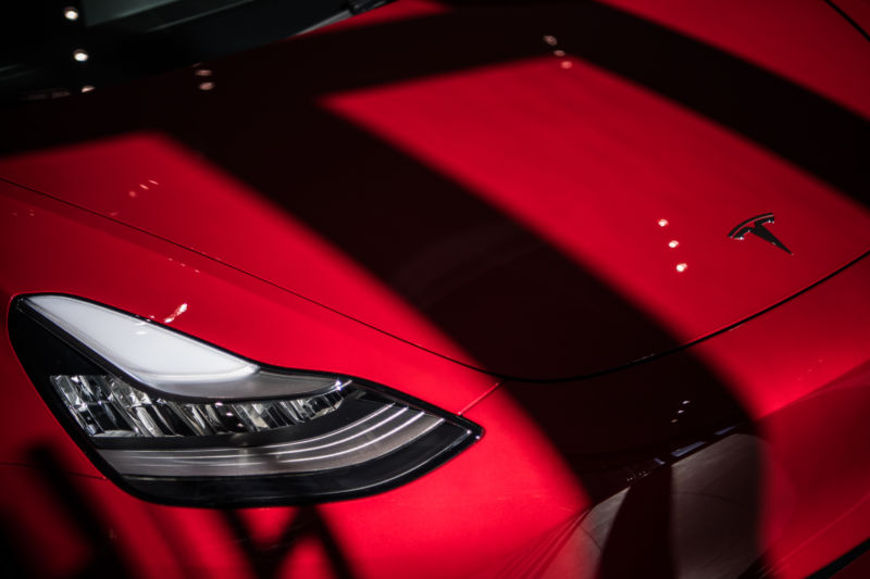 Photograph of a high-end red sports car.