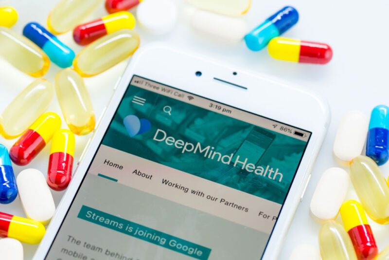 A Deepmind Health webpage sits displayed on the screen of an Apple Inc. iPhone in this arranged photograph in London, U.K. on Monday, Nov. 26, 2018. Three years ago, artificial intelligence company DeepMind Technologies Ltd. embarked on a landmark effort to transform health care in the U.K. Now plans by owner Alphabet Inc. to wrap the partnership into its Google search engine business are tripping alarm bells about privacy. Photographer: Jason Alden/Bloomberg via Getty Images