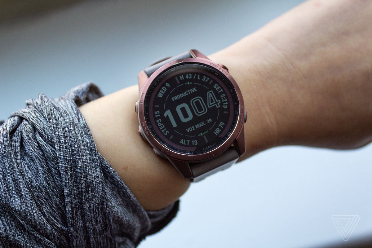 The Garmin Fenix 7S on a wrist.