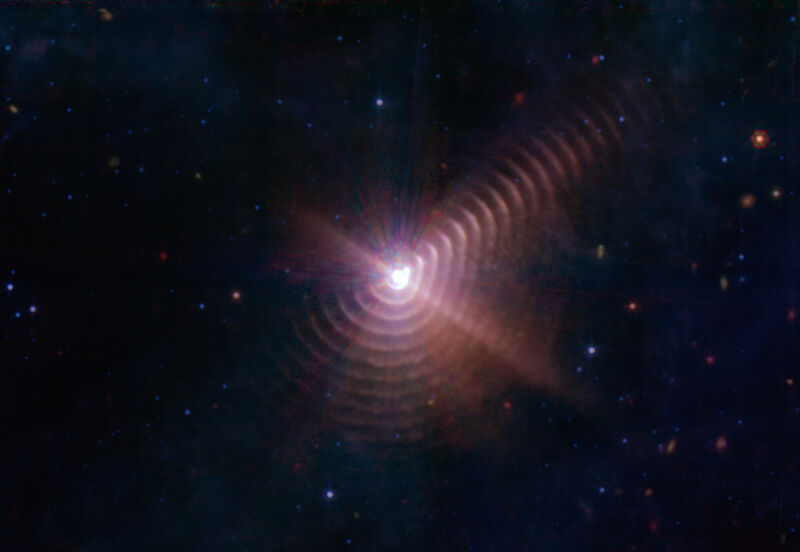 Image of a bright area partially surrounded by rings.