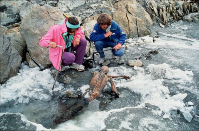 Two mountaineers with Ötzi, Europe's oldest natural human mummy, in the Ötztal Alps&nbsp;between Austria and Italy in September 1991.