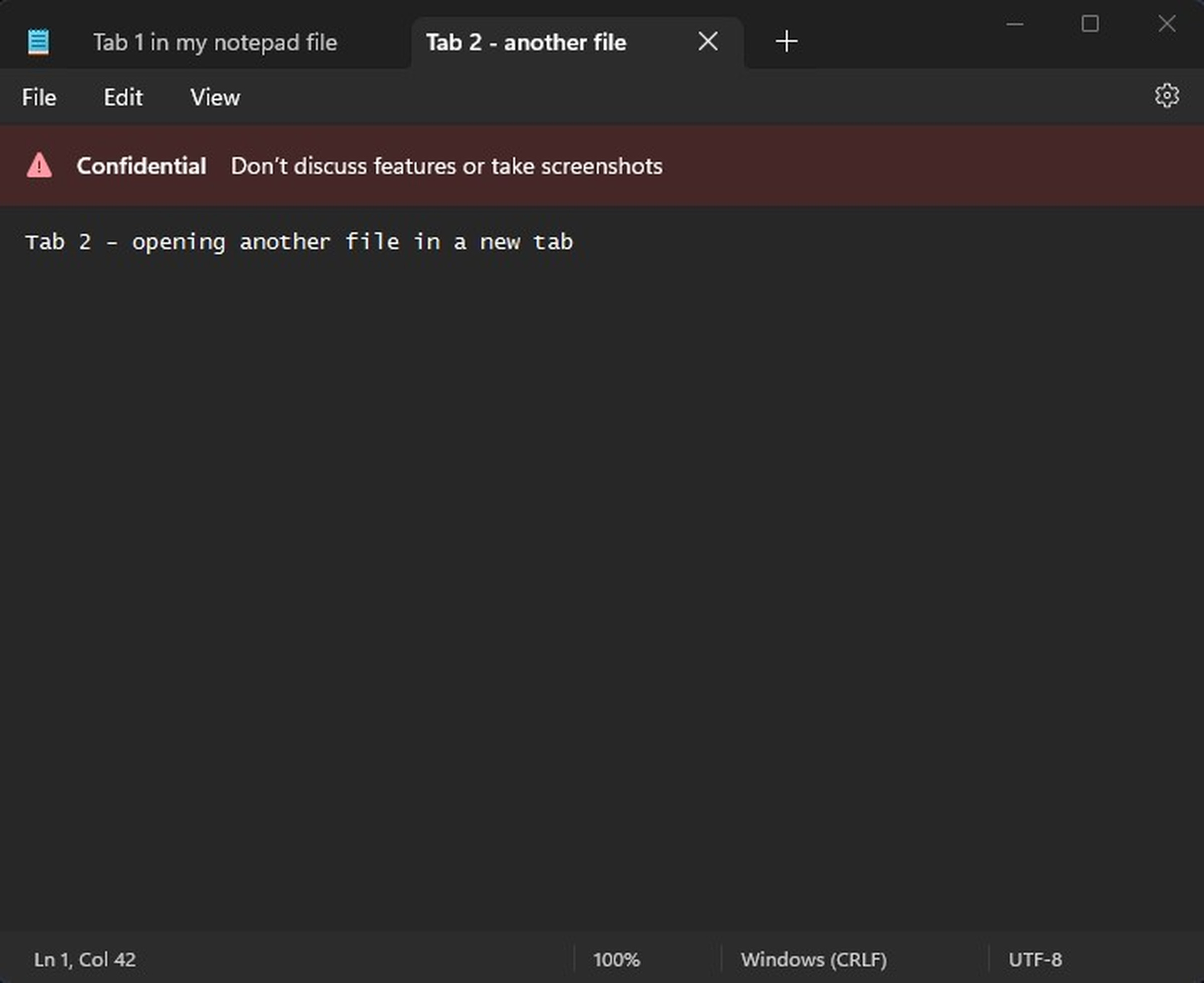 Notepad with tabs and a confidential Microsoft internal warning.