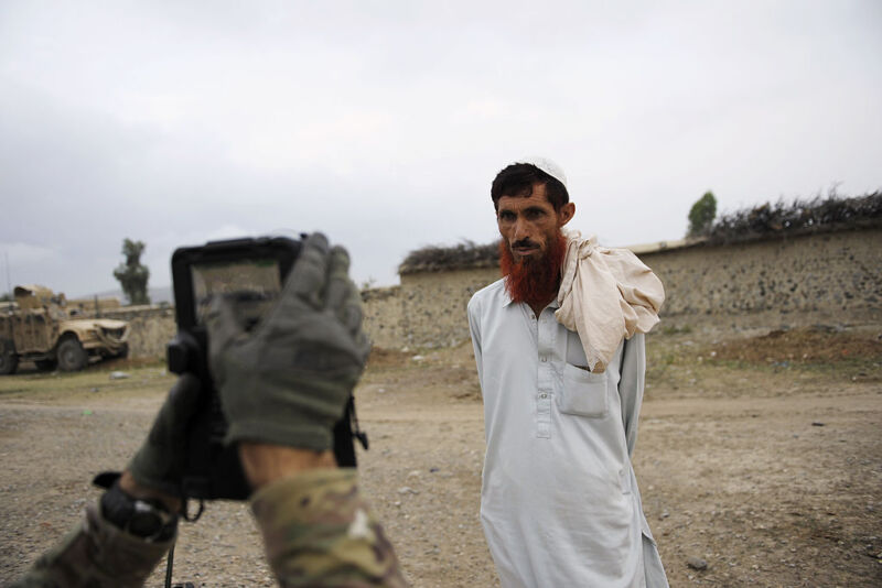 Soldier using biometric device