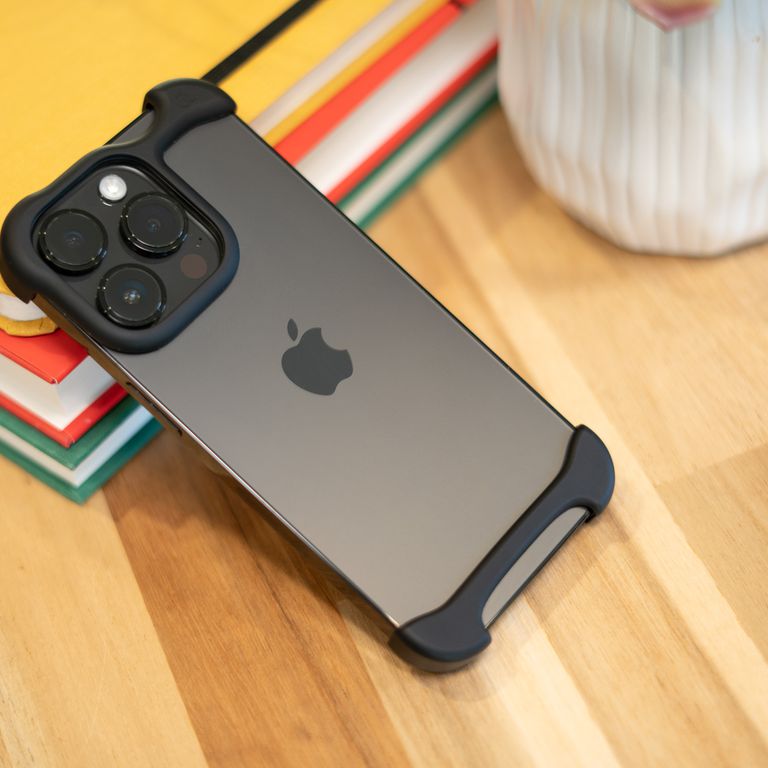 Photo of back of an iPhone 14 Pro with black matte Arc Pulse in place.